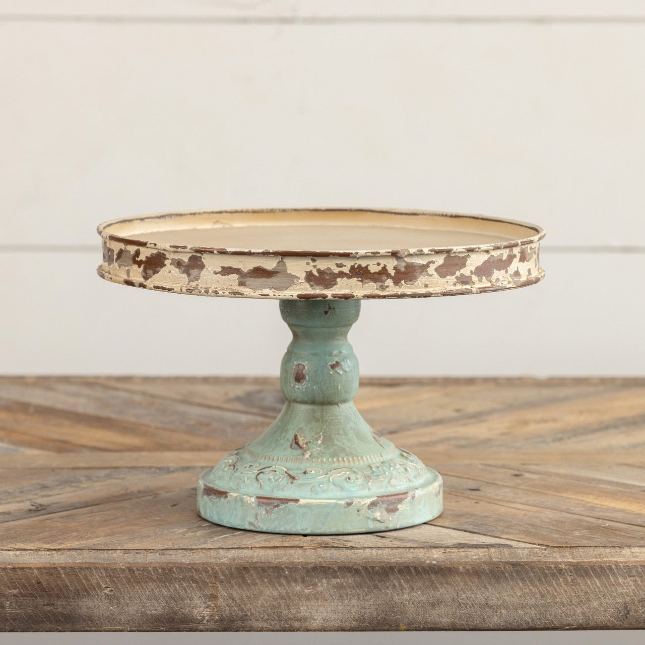 Rustic 10-inch aged riser with a distressed cream top and blue base, ideal for elevating home decor pieces or serving essentials with vintage charm.