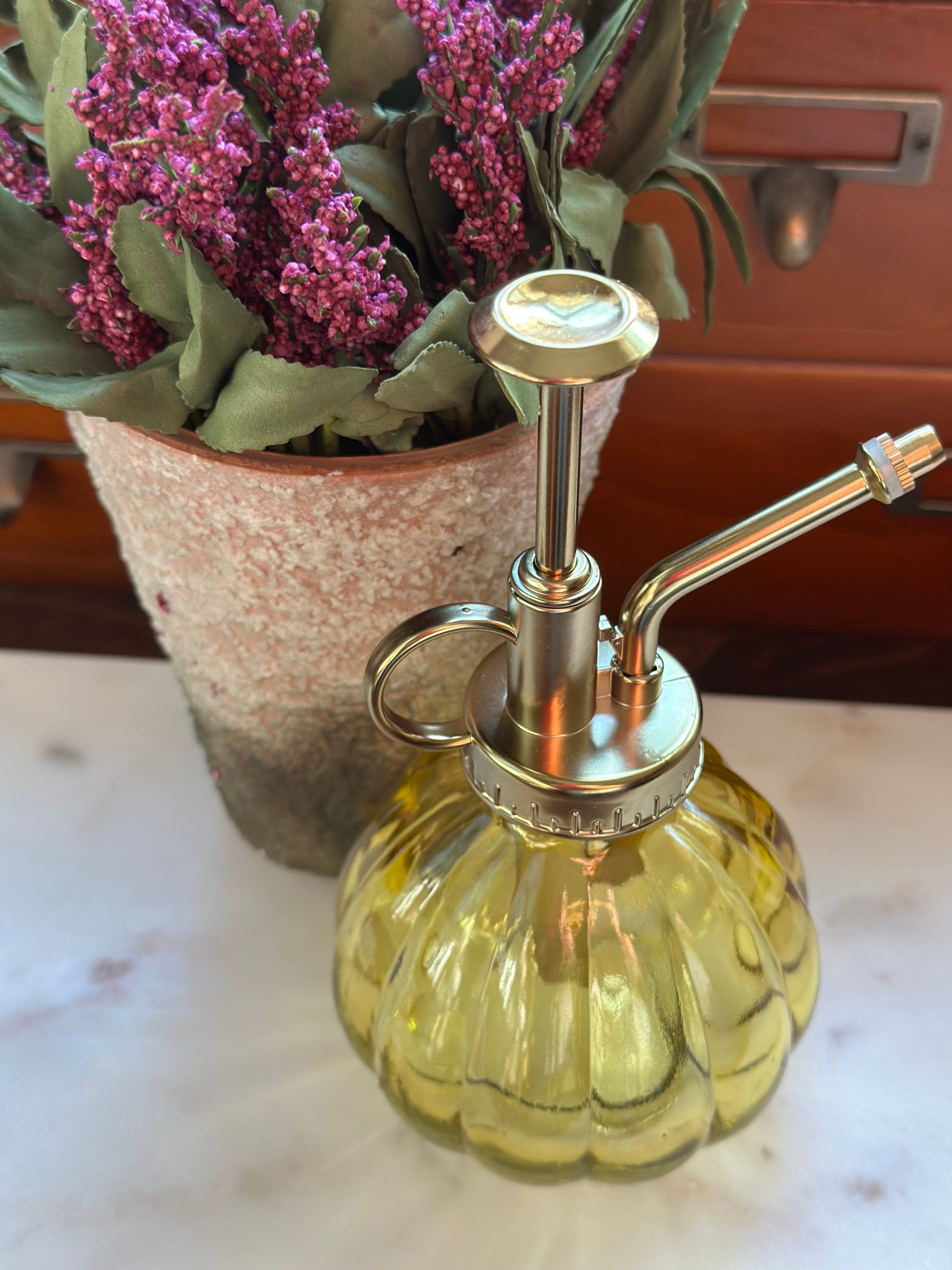 Glass Mister Yellow with brass pump, perfect for watering indoor plants. Eco-friendly glass plant mister for home and garden decor.