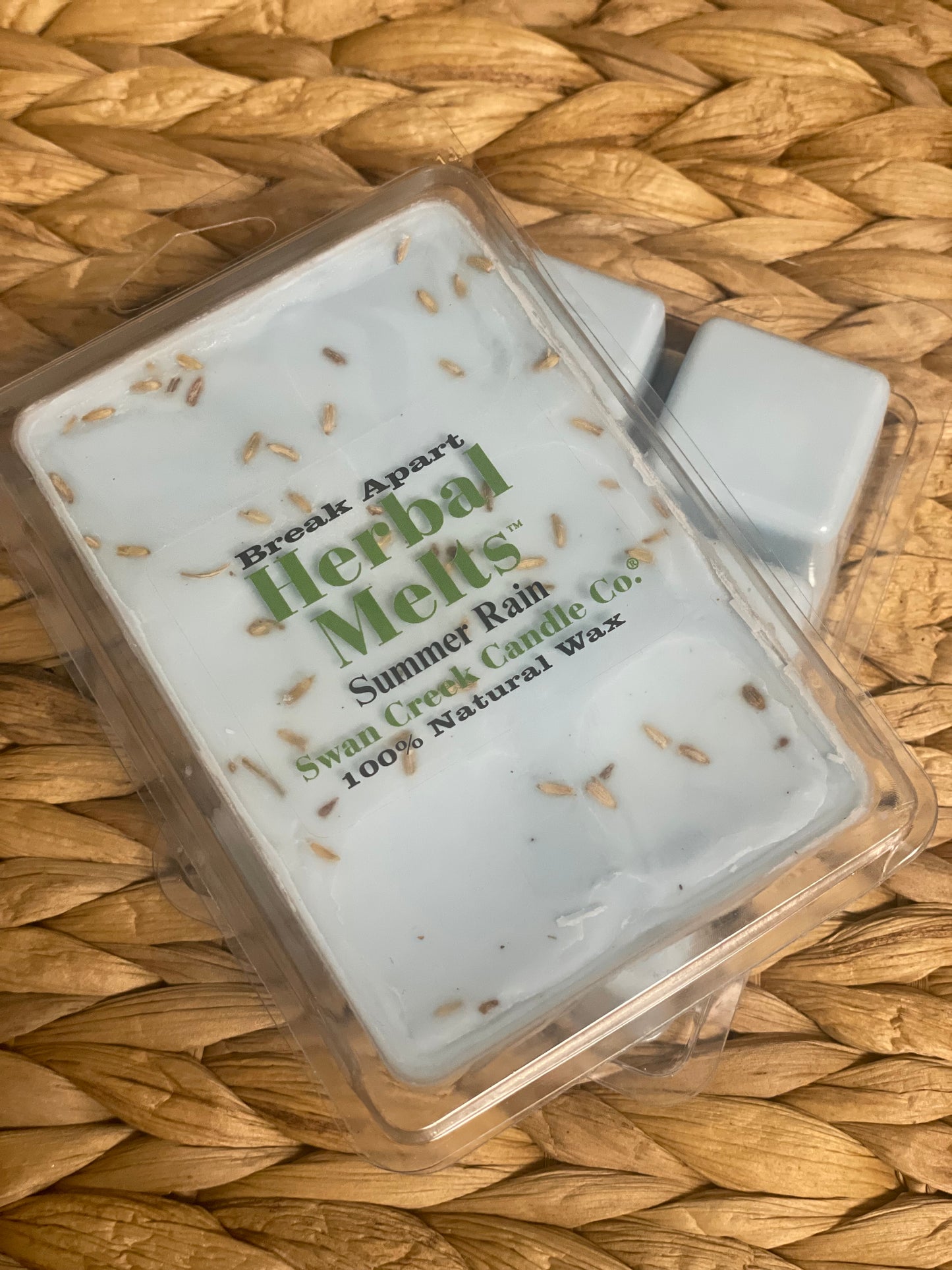 Swan Creek Herbal Melts Summer Rain scented wax cubes. Light blue break-apart candle melts with herbal accents for home fragrance.