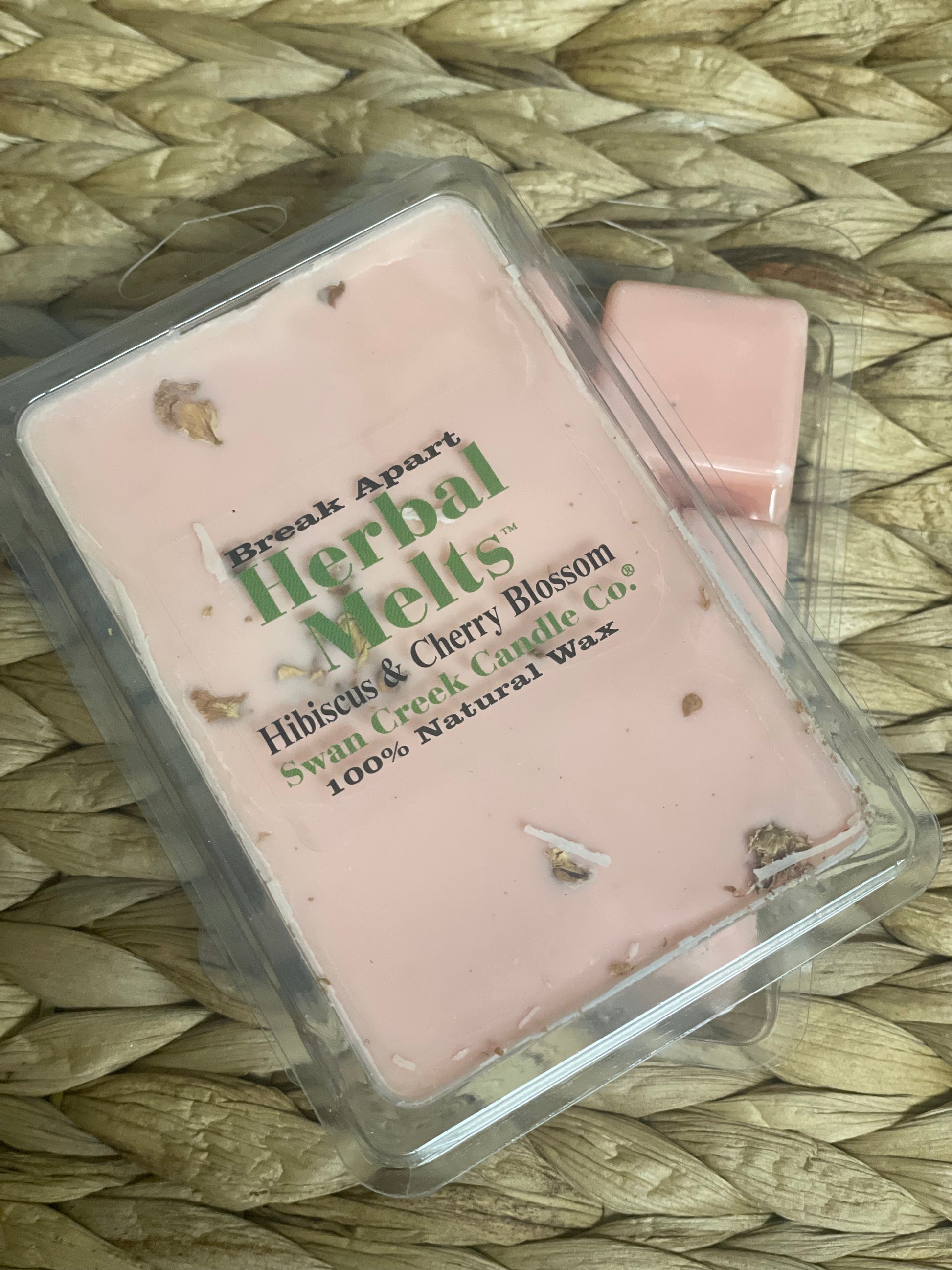Swan Creek Herbal Melts Hibiscus & Cherry Blossom scented wax cubes. Pink break-apart candle melts with floral accents for a sweet aroma.