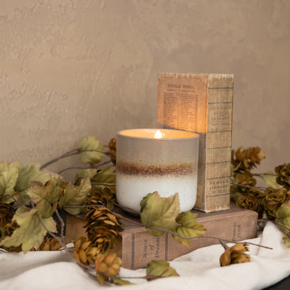 Cozy setting with the 3D Flame Grey, Tan, White Ceramic Candle - 4". A stylish flameless candle enhancing rustic decor with warm, inviting light.