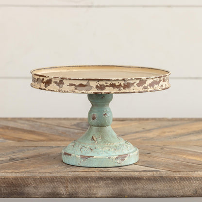 Rustic 10-inch aged riser with a distressed cream top and blue base, ideal for elevating home decor pieces or serving essentials with vintage charm.
