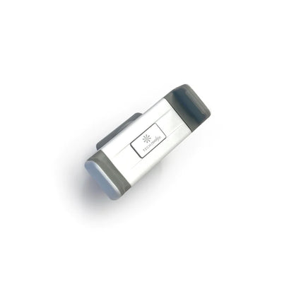 TECH CANDY ROLL WITH IT compact mobile phone holder with a sleek silver and gray design. Ideal for hands-free convenience and secure grip.