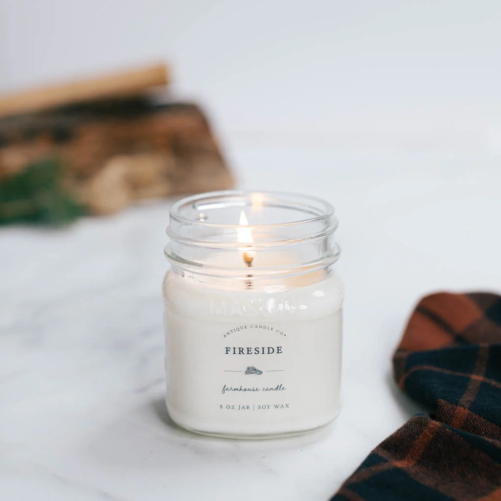 Antique Candle Co Fireside soy wax candle in an 8oz glass jar. Features a warm, smoky scent with a clean-burning cotton wick.