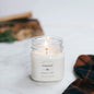 Antique Candle Co Fireside soy wax candle in an 8oz glass jar. Features a warm, smoky scent with a clean-burning cotton wick.