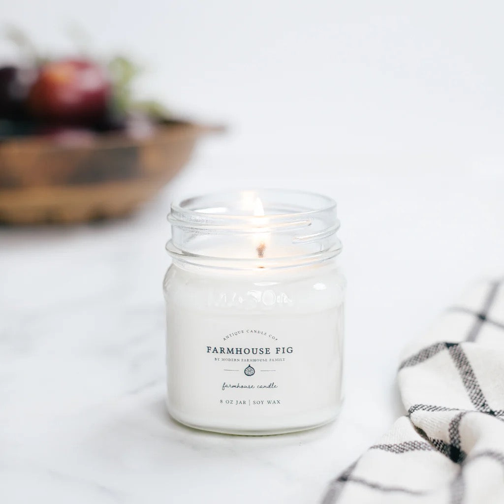 Antique Candle Co Farmhouse Fig soy wax candle in an 8oz glass jar. A fresh, earthy fragrance with a natural cotton wick.