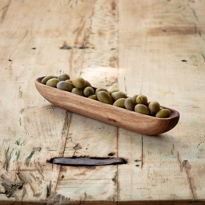 Wooden olive tray filled with green olives, ideal for serving alongside meats and cheeses. A stylish addition to any charcuterie spread.