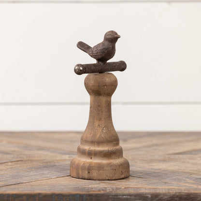Single brown perching bird figurine on a wooden pedestal, ideal for farmhouse-style home and garden decor.